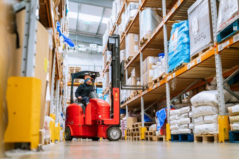 Essential Cuisine - behind the scenes 1 Forklift operator moving stock through Essential Cuisine's food manufacturing warehouse in Manchester