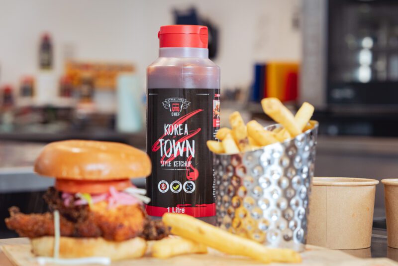 Essential Cuisine - behind the scenes 8 Essential Cuisine Street Food Chef Korea Town Style Ketchup bottle styled beside a burger and fries