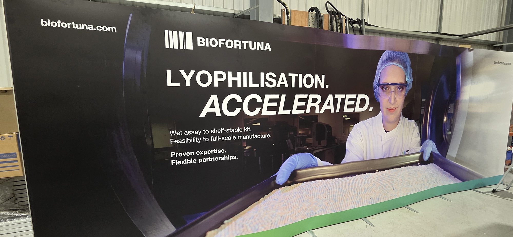 Growing a Commercial & Industrial Photography Business 10 Biofortuna exhibition stand featuring the hero photograph beside the headline 'Lyophilisation. Accelerated.' and supporting copy on lyophilisation services